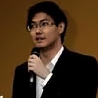 Poklin Tey speaking at an event